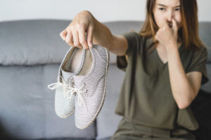 woman with smelly shoes