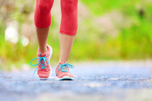 woman jogging in tennis shoes