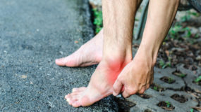 woman experiencing foot pain