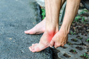 woman experiencing foot pain