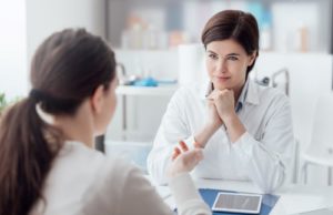 A doctor discusses treatment plans with patient.